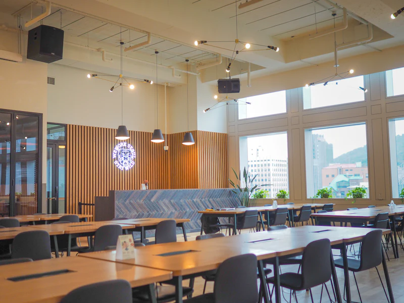 A timber-slatted wall running the length of a company café and meeting area